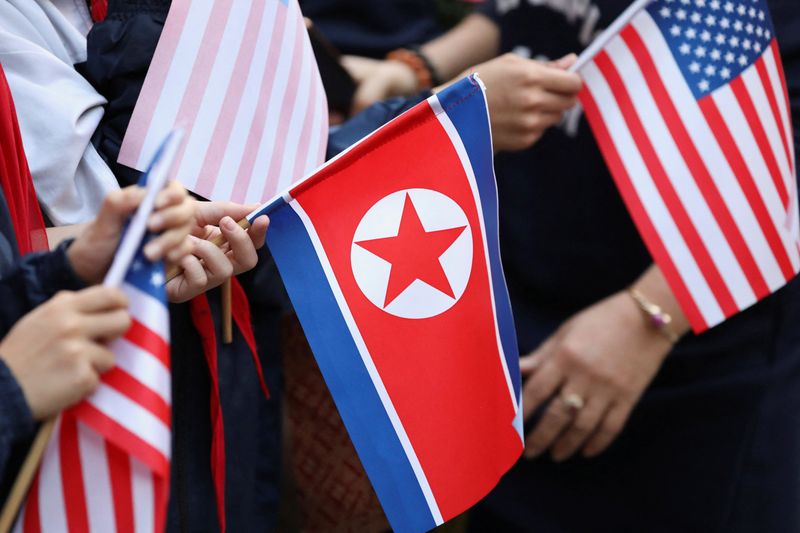 &copy; Reuters. Bystanders holding North Korea and U.S. flags wait for the motorcade of U.S. President Donald Trump in Hanoi, Vietnam, February 27, 2019. REUTERS/Ann Wang/Files