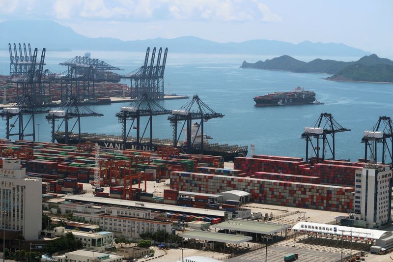 &copy; Reuters. FILE PHOTO: A cargo ship carrying containers is seen near the Yantian port in Shenzhen, Guangdong province, China May 17, 2020. REUTERS/Martin Pollard/File Photo