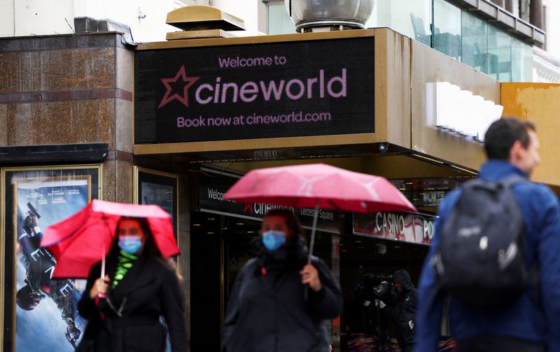 &copy; Reuters. FILE PHOTO: People walk past a Cineworld in Leicester's Square, amid the coronavirus disease (COVID-19) outbreak in London, Britain, October 4, 2020. REUTERS/Henry Nicholls