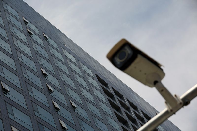 &copy; Reuters. FILE PHOTO: A surveillance camera is pictured outside the China Securities Regulatory Commission (CSRC) building on the Financial Street in Beijing, China July 9, 2021. REUTERS/Tingshu Wang