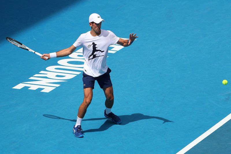 &copy; Reuters. Serbian tennis player Novak Djokovic practices on Rod Laver Arena ahead of the 2022 Australian Open at Melbourne Park, in Melbourne, Australia, January 11, 2022. Kelly Defina/Pool via REUTERS