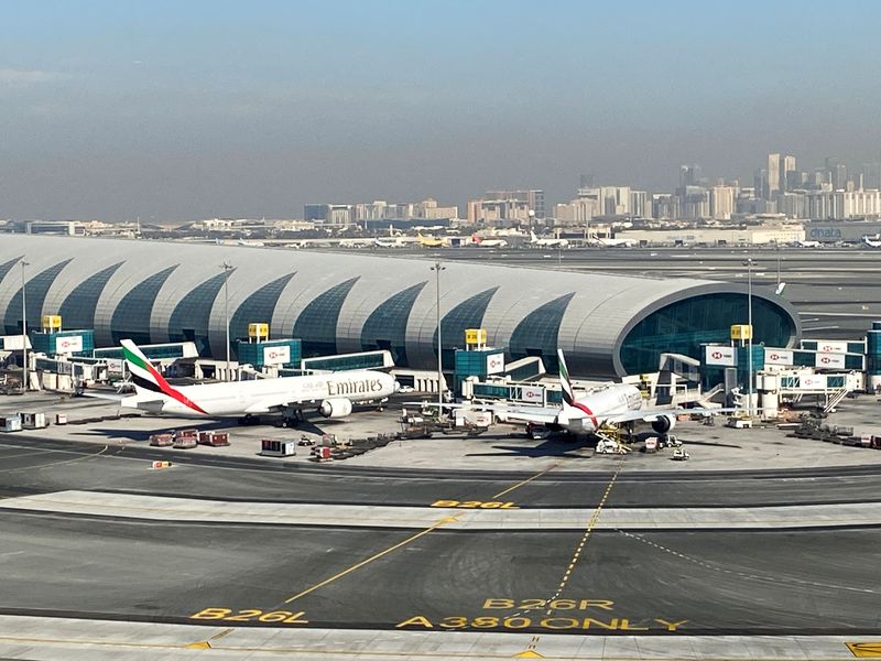 &copy; Reuters. FILE PHOTO: Emirates planes are seen on the tarmac in a general view of Dubai International Airport in Dubai, United Arab Emirates January 13, 2021. Picture taken through a window. REUTERS/Abdel Hadi Ramahi