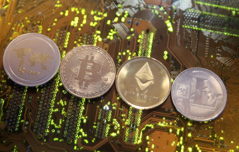 &copy; Reuters. FILE PHOTO: Representations of the Ripple, Bitcoin, Etherum and Litecoin virtual currencies are seen on a PC motherboard in this illustration picture, February 13, 2018. REUTERS/Dado Ruvic/Illustration/