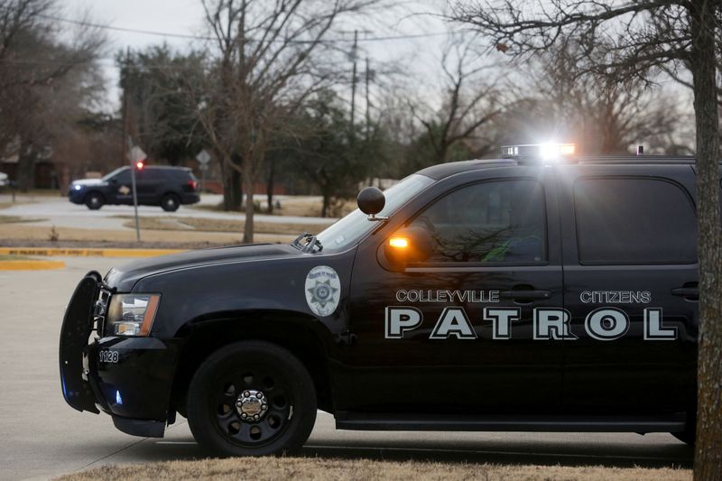 &copy; Reuters. Law enforcement vehicles are seen in the area where a man has reportedly taken people hostage at a synagogue during services that were being streamed live, in Colleyville, Texas, U.S. January 15, 2022. REUTERS/Shelby Tauber
