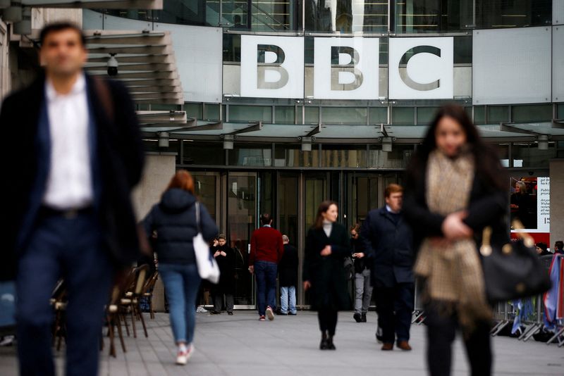 &copy; Reuters. FILE PHOTO: Pedestrians walk past a BBC logo at Broadcasting House in London, Britain, January 29, 2020. REUTERS/Henry Nicholls/File Photo