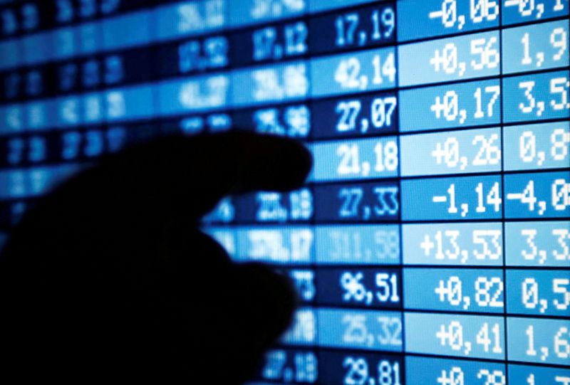 &copy; Reuters. A man points at a computer screen showing stock information in this illustration photo taken in Bordeaux, France, March 30, 2016. REUTERS/Regis Duvignau