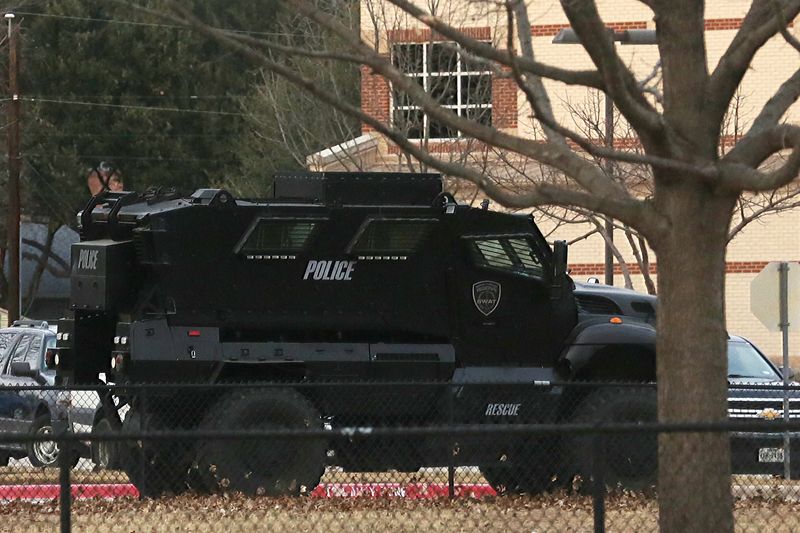 &copy; Reuters. FILE PHOTO: A law enforcement vehicle is parked at a school in the area where a man believed to have taken people hostage at a synagogue during services that were being streamed live, in Colleyville, Texas, U.S. January 15, 2022. REUTERS/Shelby Tauber