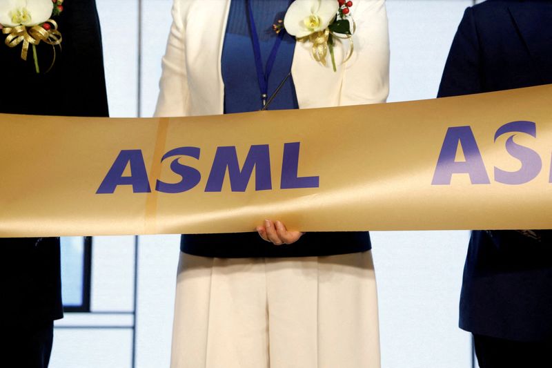 &copy; Reuters. FILE PHOTO: Company representatives and government officials cut a ribbon during the opening ceremony of the EUV training center at ASML Holding in Tainan, Taiwan, August 20, 2020. REUTERS/Ann Wang
