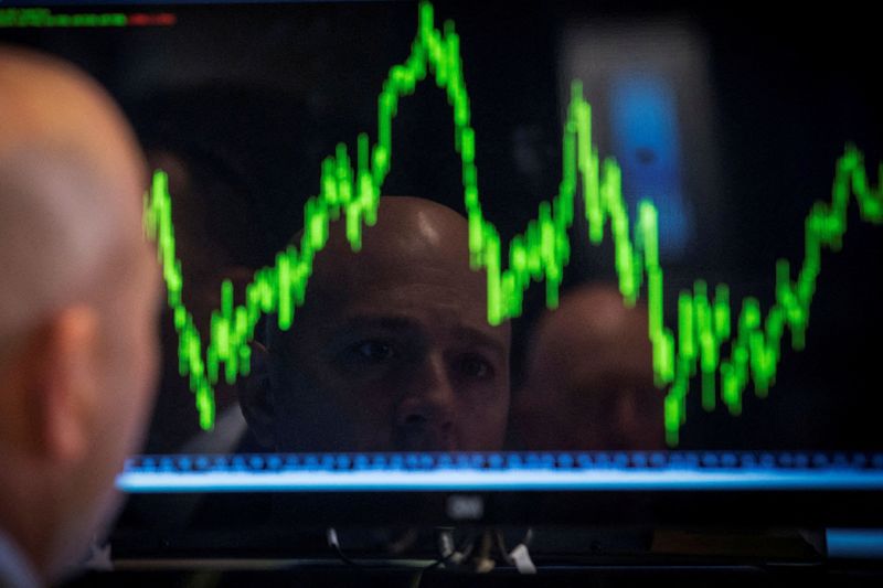 &copy; Reuters. FILE PHOTO: A trader watches his chart while working on the floor of the New York Stock Exchange July 8, 2014. REUTERS/Brendan McDermid