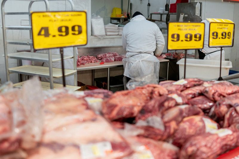 &copy; Reuters. FILE PHOTO: A grocery store worker wears a mask while working in the meat department of a grocery store as the outbreak of the coronavirus disease (COVID-19) continues in the Brooklyn borough of New York U.S., May 5, 2020. REUTERS/Lucas Jackson/File Photo