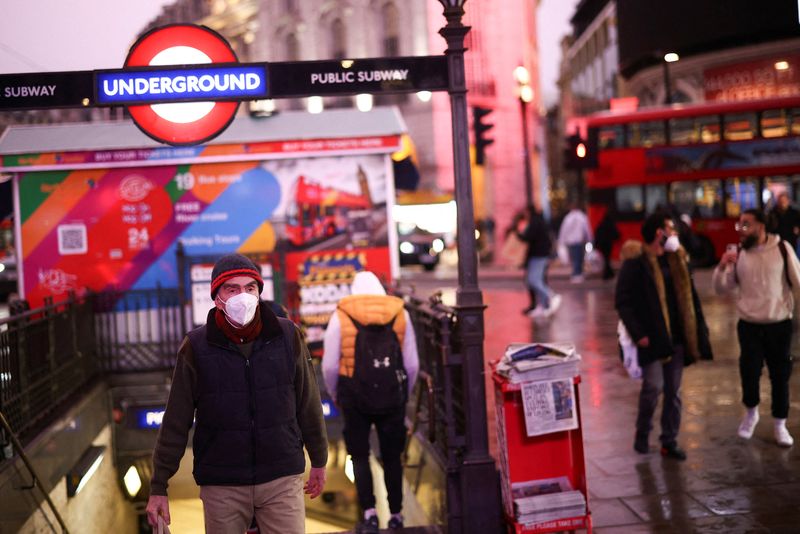 &copy; Reuters. FILE PHOTO: People exit Piccadilly Circus underground station, amid the coronavirus disease (COVID-19) outbreak, in central London, Britain, January 6, 2022. REUTERS/Henry Nicholls