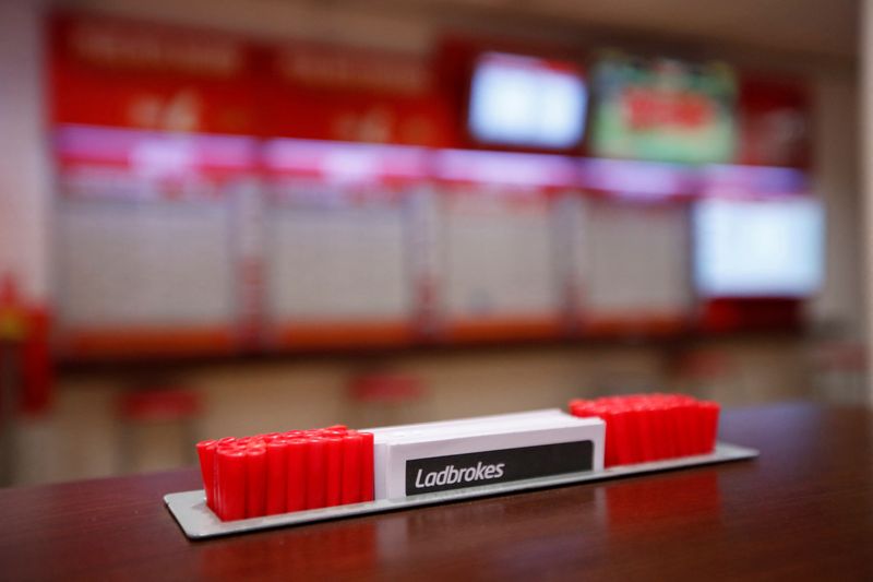 &copy; Reuters. FILE PHOTO: General view inside a deserted Ladbrokes shop in Harpenden as the spread of the coronavirus disease (COVID-19) continues, in Harpenden, Britain, March 18, 2020. REUTERS/Peter Cziborra/File Photo