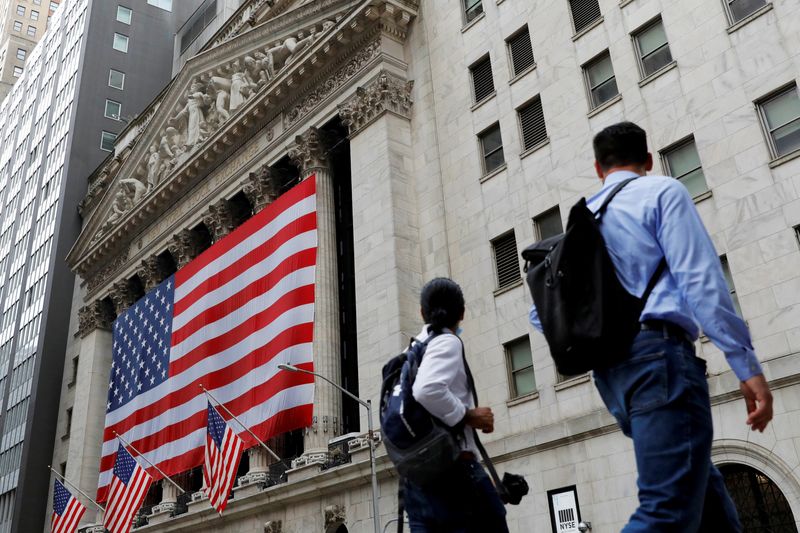 &copy; Reuters. People walk by the New York Stock Exchange (NYSE) in Manhattan, New York City, U.S., August 9, 2021. REUTERS/Andrew Kelly