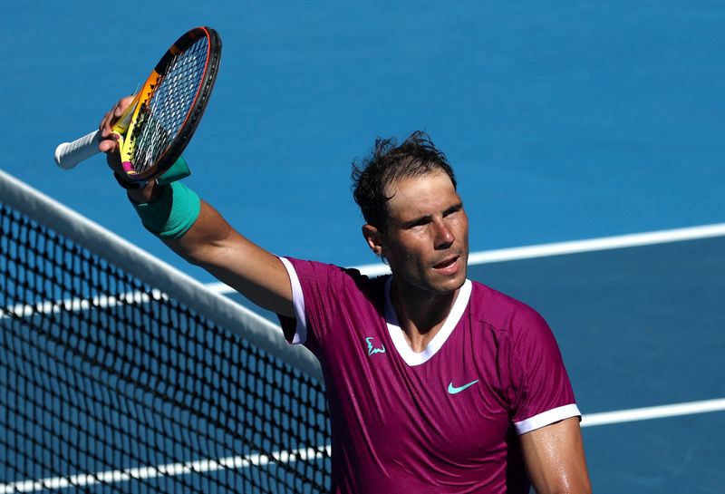 &copy; Reuters. Rafael Nadal comemora após vencer alemão Yannick Hanfmann na segunda rodada do Aberto da Austrália
19/01/2022 REUTERS/Loren Elliott