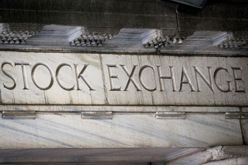 &copy; Reuters. FILE PHOTO: "Stock Exchange" is seen over an entrance to the New York Stock Exchange (NYSE) on Wall St. in New York City, U.S., March 29, 2021.  REUTERS/Brendan McDermid/File Photo