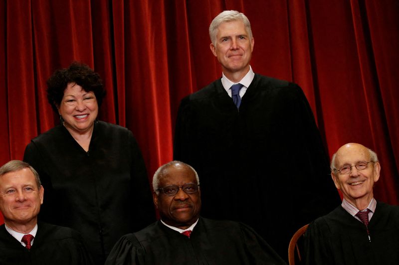 &copy; Reuters. FILE PHOTO: U.S. Supreme Court Justice Neil Gorsuch (top R) smiles as he joins his fellow justices, including Chief Justice John Roberts (L-R), Justice Sonia Sotomayor, Justice Clarence Thomas and Justice Stephen Breyer, in taking a new family photo inclu