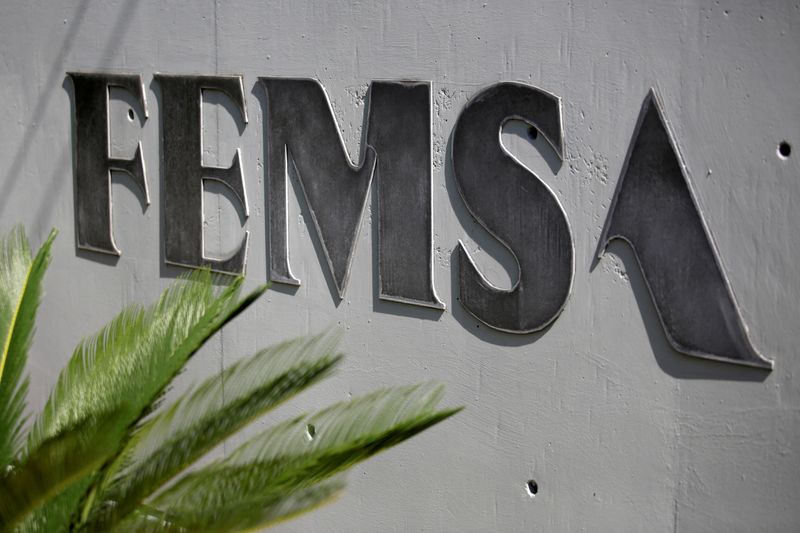 &copy; Reuters. FILE PHOTO: The logo of Mexico's Coca-Cola FEMSA, the world's biggest Coke bottler, is pictured at its headquarters in Monterrey, Mexico, August 19, 2018. REUTERS/Daniel Becerril/File Photo