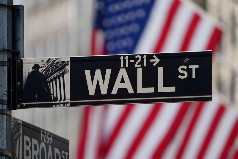 &copy; Reuters. FILE PHOTO: The Wall Street sign is pictured at the New York Stock exchange (NYSE) in the Manhattan borough of New York City, New York, U.S., March 9, 2020. REUTERS/Carlo Allegri/File Photo
