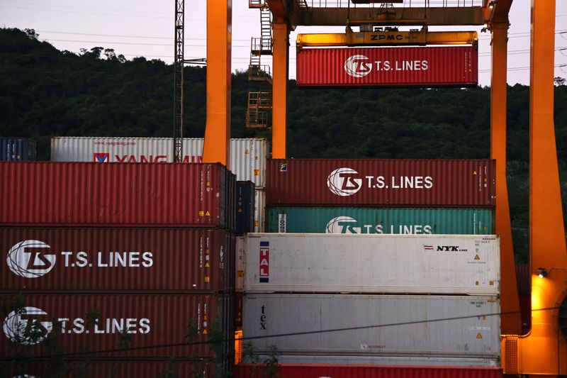&copy; Reuters. FILE PHOTO: Cargo cranes are seen moving containers at a container yard in Keelung, Taiwan, November 18, 2020. REUTERS/Ann Wang