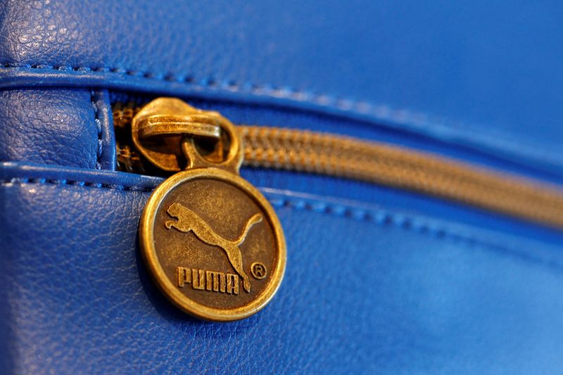 &copy; Reuters. FILE PHOTO: A handbag with the logo of German sports goods firm Puma is pictured in a shop after the company's annual news conference in Herzogenaurach, Germany February 20, 2014.  REUTERS/Michaela Rehle/File Photo  GLOBAL BUSINESS WEEK AHEAD