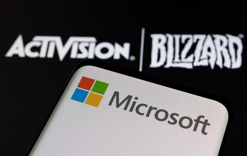&copy; Reuters. Microsoft logo is seen on a smartphone placed on displayed Activision Blizzard logo in this illustration taken January 18, 2022. REUTERS/Dado Ruvic/Illustration