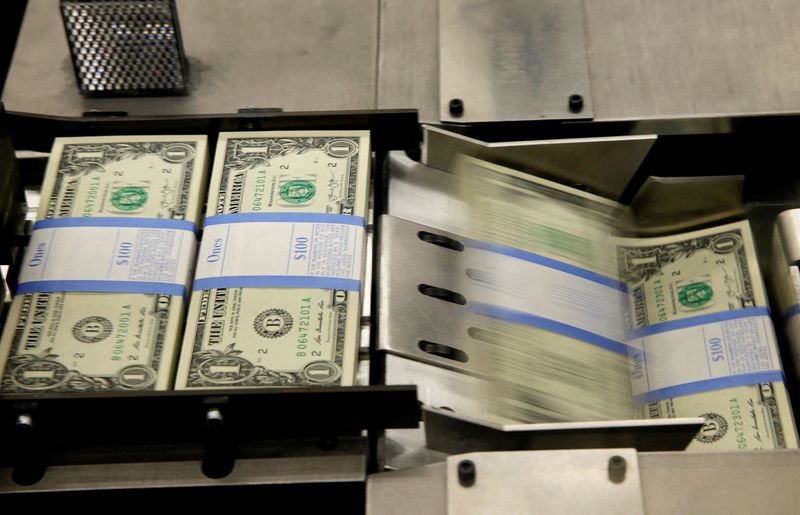 &copy; Reuters. FILE PHOTO: United States one dollar bills are put in packaging bands during production at the Bureau of Engraving and Printing in Washington November 14, 2014.   REUTERS/Gary Cameron/File Photo