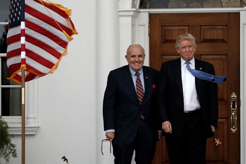 &copy; Reuters. FILE PHOTO: U.S. President-elect Donald Trump stands with former New York City Mayor Rudolph Giuliani before their meeting at Trump National Golf Club in Bedminster, New Jersey, U.S., November 20, 2016.  REUTERS/Mike Segar/File Photo