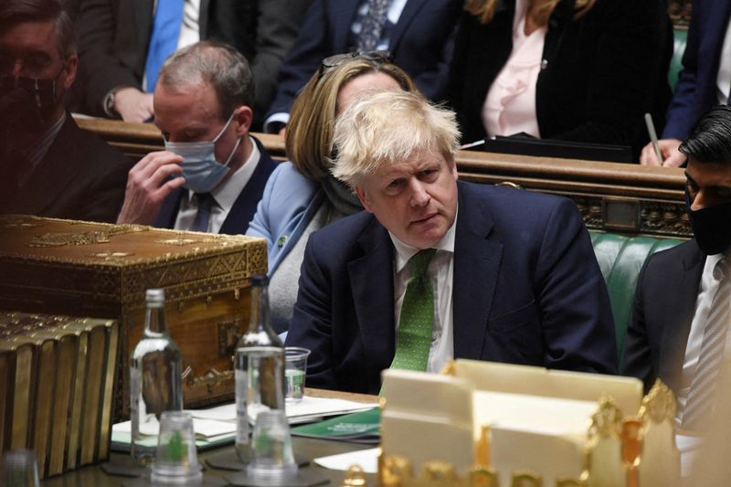 &copy; Reuters. FILE PHOTO: British Prime Minister Boris Johnson listens during the weekly question time debate at Parliament in London, Britain, January 19, 2022. UK Parliament/Jessica Taylor/Handout via REUTERS  ATTENTION EDITORS - THIS IMAGE HAS BEEN SUPPLIED BY A THI