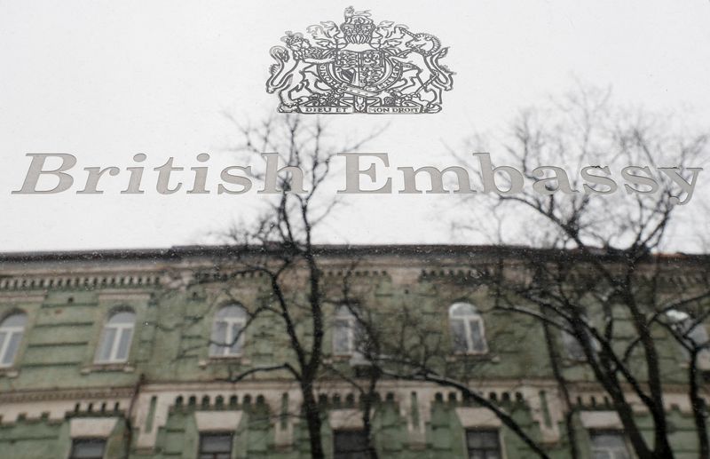 &copy; Reuters. A building, which is located on the opposite side of a street, is reflected in a sign hanging on the facade of the British Embassy in Kyiv, Ukraine January 24, 2022. The British Embassy in Ukraine said some staff and dependants were being withdrawn from K