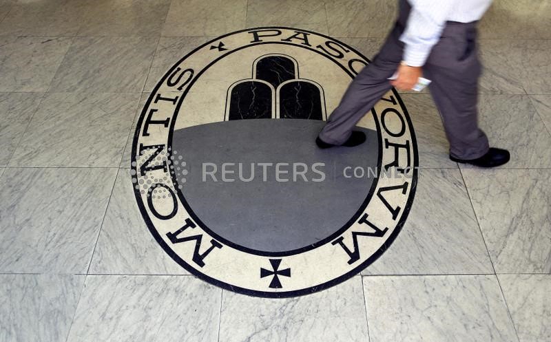 &copy; Reuters. A man walks on a logo of the Monte Dei Paschi Di Siena bank in Rome, Italy September 24, 2013.  REUTERS/Alessandro Bianchi/File Photo               GLOBAL BUSINESS WEEK AHEAD PACKAGE - SEARCH 'BUSINESS WEEK AHEAD 24 OCT'  FOR ALL IMAGES
