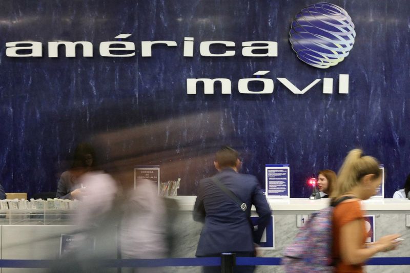 &copy; Reuters. FILE PHOTO: The logo of America Movil is pictured on the wall of a reception area in the company's corporate offices in Mexico City, Mexico, May 18, 2017. REUTERS/Edgard Garrido/File Photo
