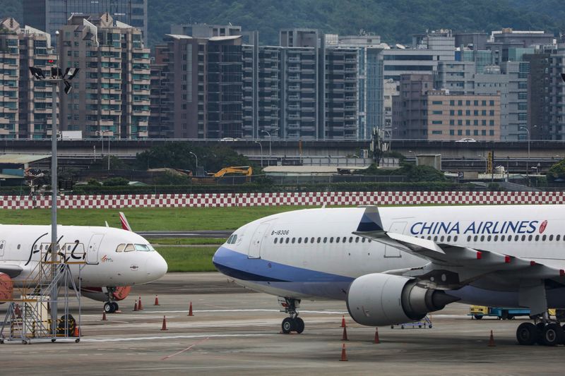 &copy; Reuters. FILE PHOTO: Passenger jets of Taiwan's China Airlines at Taipei Songshan Airport in Taipei, Taiwan, June 8, 2020.REUTERS/Ann Wang