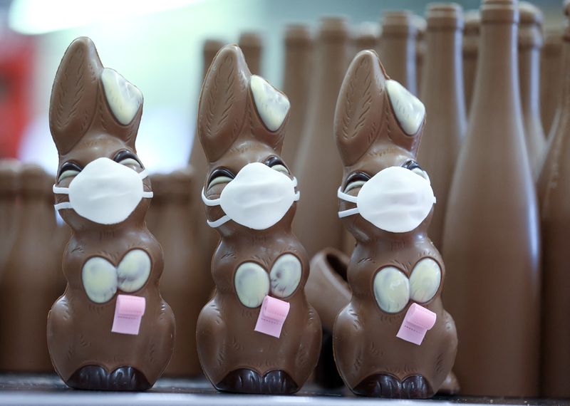 &copy; Reuters. Chocolate Easter Bunnies with a protective mask and a roll of toilet paper are seen at a chocolate factory in Pirmasens, Germany, April 9, 2020, as the spread of the coronavirus disease (COVID-19) continues. REUTERS/Ralph Orlowski