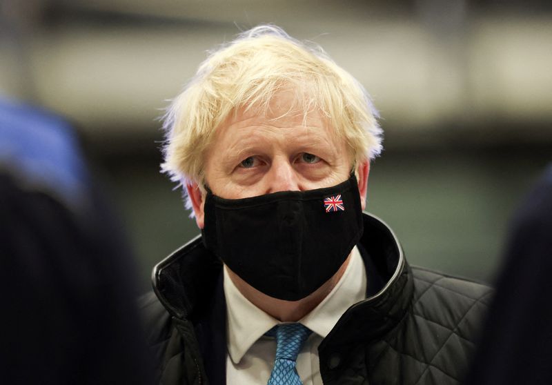 &copy; Reuters. FILE PHOTO: British Prime Minister Boris Johnson wears a face mask as he visits RAF Valley in Anglesey, Britain January 27, 2022. REUTERS/Carl Recine