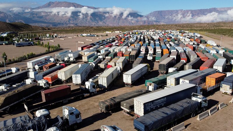 &copy; Reuters. Parked trucks are pictured during a protest against new Chilean entry protocols to the country, that demand all drivers test negative for coronavirus disease (COVID-19), at the Argentine border with Chile, in Uspallata, Mendoza, Argentina January 28, 2022