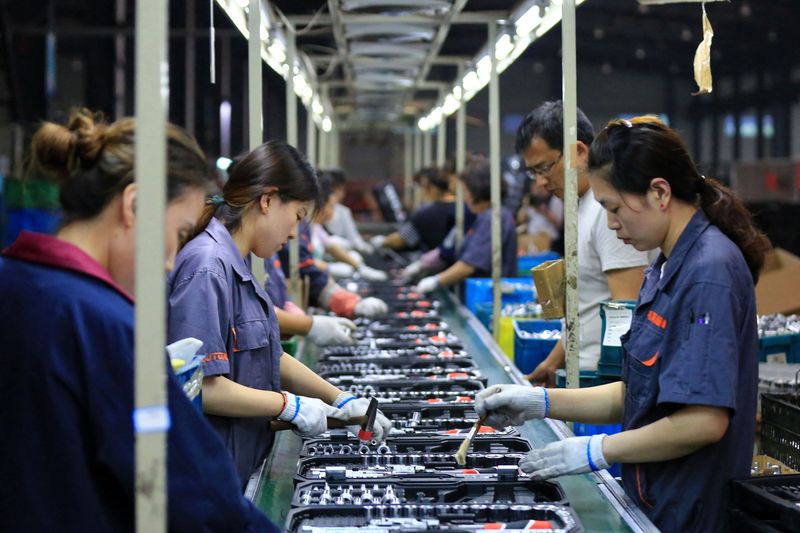 &copy; Reuters. Employees work on a production line manufacturing tools at a factory in Huaian, Jiangsu province, China May 26, 2019. Picture taken May 26, 2019. REUTERS/Stringer ATTENTION EDITORS - THIS IMAGE WAS PROVIDED BY A THIRD PARTY. CHINA OUT.