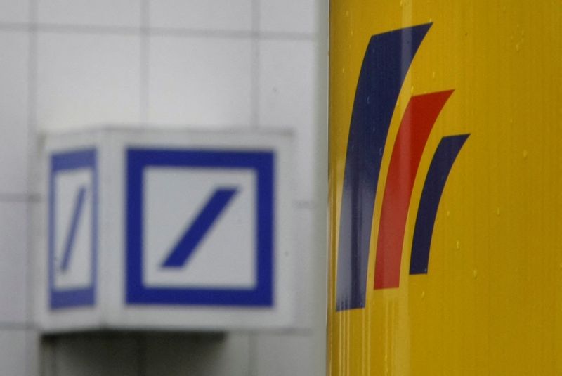 &copy; Reuters. FILE PHOTO: The logos of Deutsche Bank and Postbank are pictured in front of the Postbank headquarters in Bonn September 12, 2008.  REUTERS/Alex Grimm/File Photo