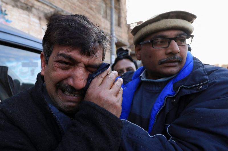 &copy; Reuters. A relative mourns the death of priest William Siraj, who, according to police, was killed by unknown armed men in Peshawar, Pakistan January 30, 2022. REUTERS/Fayaz Aziz