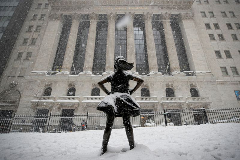 &copy; Reuters. FILE PHOTO: The "Fearless Girl" sculpture is seen outside the New York Stock Exchange (NYSE) during a snow storm in the Manhattan borough of New York City, New York, U.S., February 1, 2021.  REUTERS/Brendan McDermid/File Photo