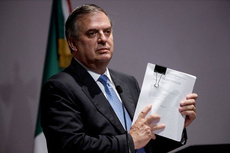 &copy; Reuters. FILE PHOTO: Mexican Foreign Minister Marcelo Ebrard holds documents during a news conference to announce that Mexico sued several gun makers in a U.S. federal court, accusing them of negligent business practices that generated illegal arms trafficking whi