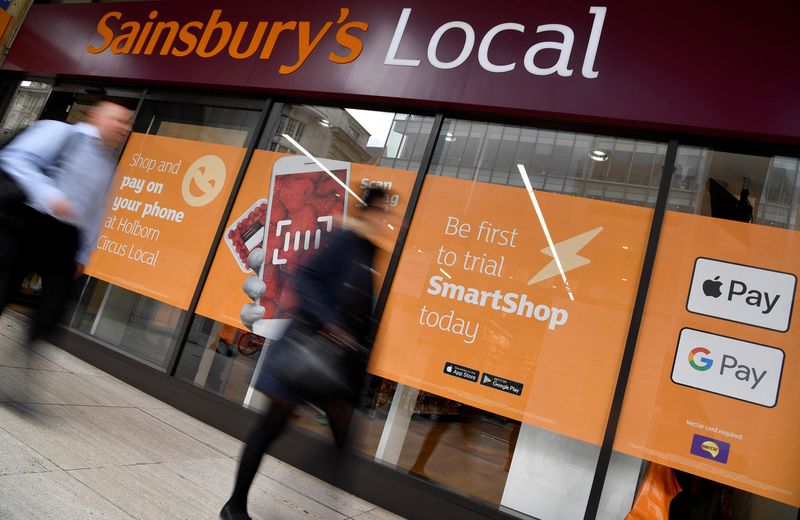 &copy; Reuters. FILE PHOTO: Shoppers walk past the first 'till-free' Sainsbury's store in London, Britain, May 1, 2019.  REUTERS/Toby Melville