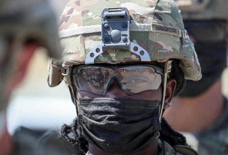 &copy; Reuters. Troops are reflected in the glasses of a U.S. Army serviceman, as he takes part in the multinational military exercise "Agile Spirit 2021" at Orpolo firing range, Georgia August 6, 2021.  REUTERS/Irakli Gedenidze