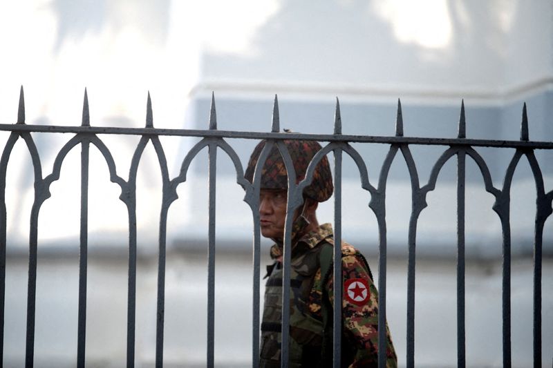 &copy; Reuters. FILE PHOTO: A Myanmar soldier looks on as he stands inside city hall after soldiers occupied the building, in Yangon, Myanmar February 2, 2021. REUTERS/Stringer