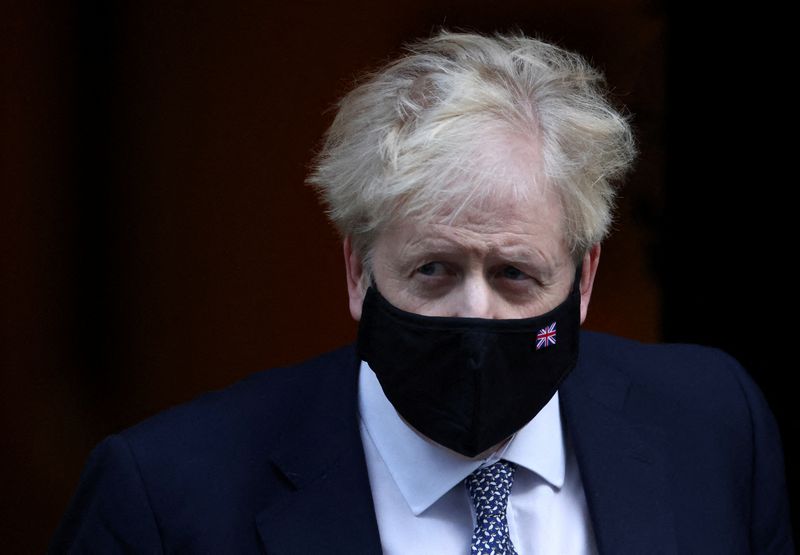 &copy; Reuters. FILE PHOTO: British Prime Minister Boris Johnson walks outside Downing Street in London, Britain, January 12, 2022. REUTERS/Henry Nicholls