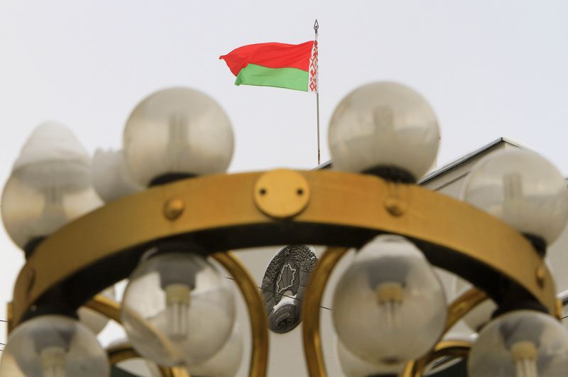 &copy; Reuters. The National flag and emblem of Belarus are seen at the top of the Constitutional Court headquarters in Minsk February 3, 2010.  REUTERS/Vasily Fedosenko  (BELARUS - Tags: POLITICS)