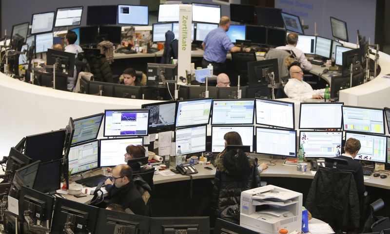 &copy; Reuters. FILE PHOTO: Traders work at their screens at the stock exchange in Frankfurt January 23, 2015. REUTERS/Pawel Kopczynski/remote