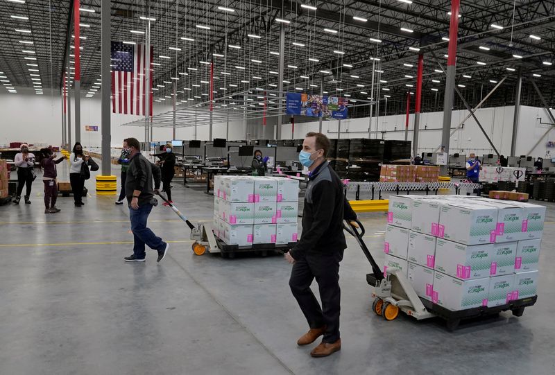 &copy; Reuters. FILE PHOTO: Boxes containing the Moderna COVID-19 vaccine are prepared to be shipped at the McKesson distribution center in Olive Branch, Mississippi, U.S. December 20, 2020. Paul Sancya/Pool via REUTERS/File Photo