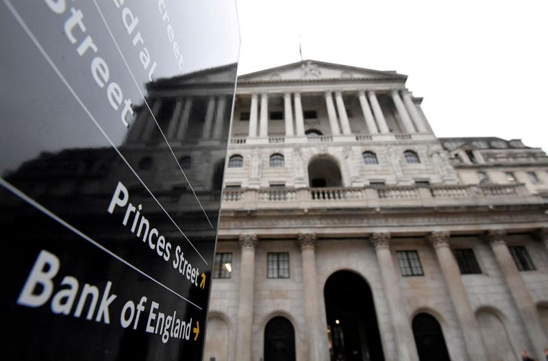&copy; Reuters. FILE PHOTO: The Bank of England (BoE) building is reflected in a sign, after the BoE became the first major world's central bank to raise rates since the coronavirus disease (COVID-19) pandemic, London, Britain, December 16, 2021. REUTERS/Toby Melville//F
