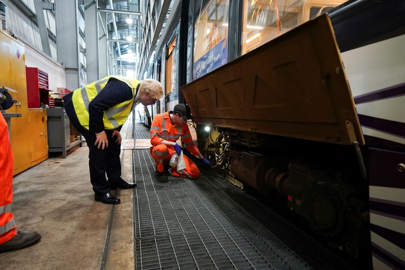 &copy; Reuters. British Prime Minister Boris Johnson visits the Blackpool Transport bus depot in Blackpool, Britain, February 3, 2022.   Peter Byrne/Pool via REUTERS