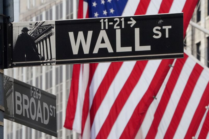 &copy; Reuters. FILE PHOTO: The Wall Street sign is pictured at the New York Stock exchange (NYSE) in the Manhattan borough of New York City, New York, U.S., March 9, 2020. REUTERS/Carlo Allegri/File Photo
